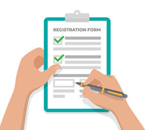 Hand filling out a registration form with checkboxes marked and a pen in hand.