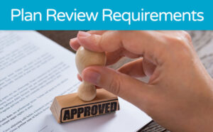 Hand stamping 'APPROVED' on a document titled 'Plan Review Requirements'