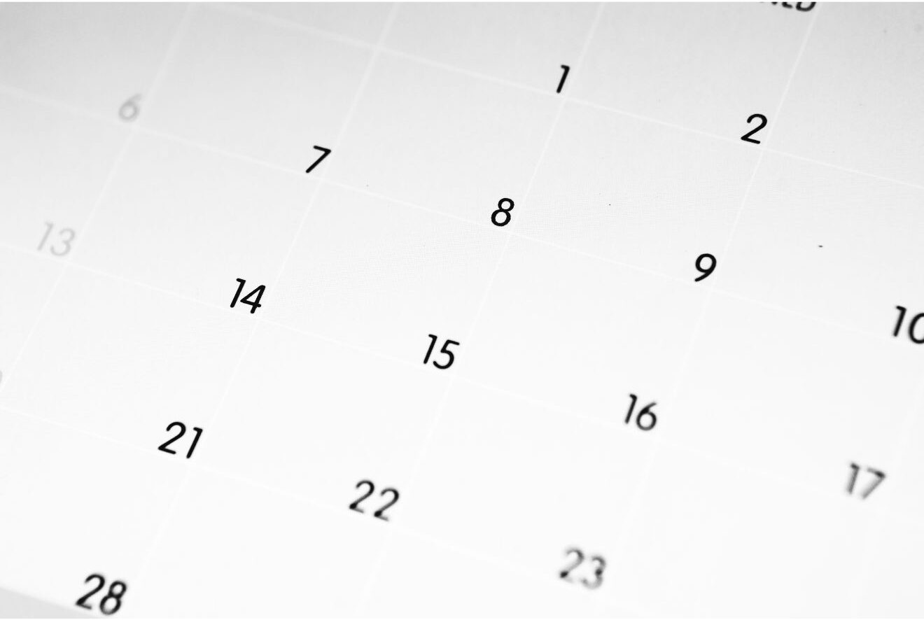 Close-up view of a calendar with several dates visible