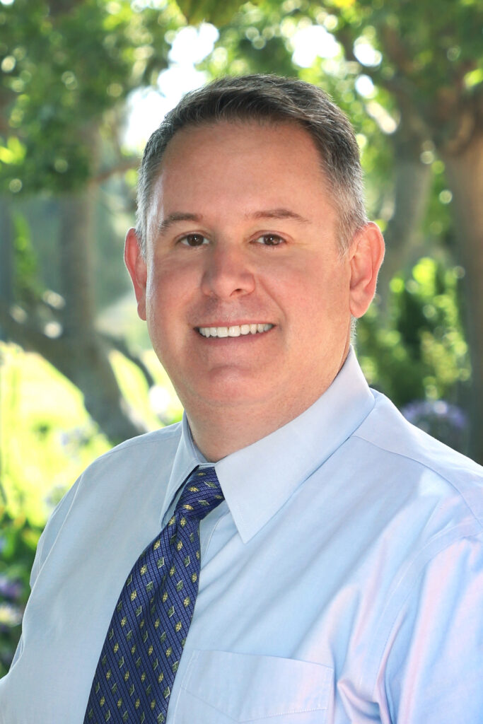 Portrait of a man in a shirt and tie, outdoors