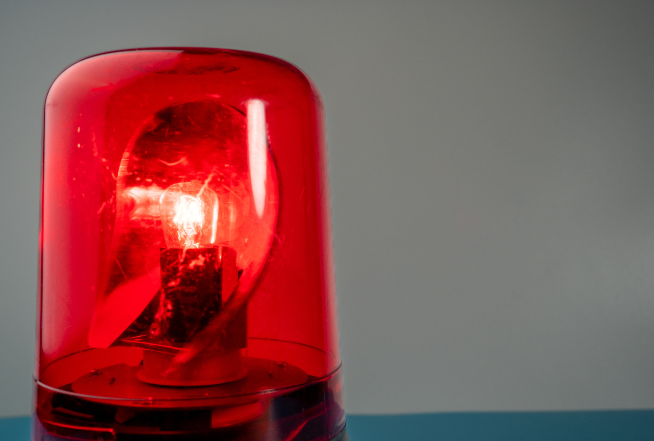 Close-up view of a red emergency siren light.