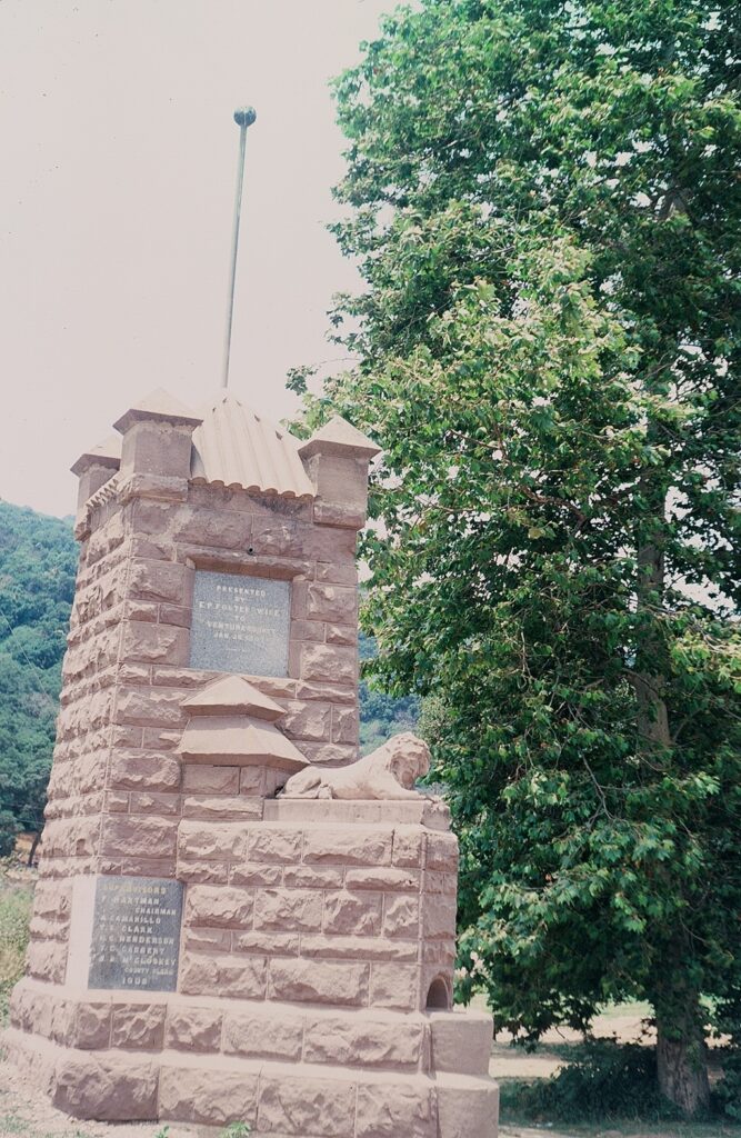 Foster Park entrance marker with stone lion.