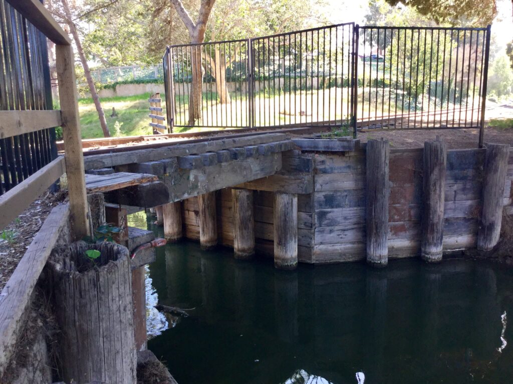 Historic railroad trestle over water at Hueneme Slough Site.