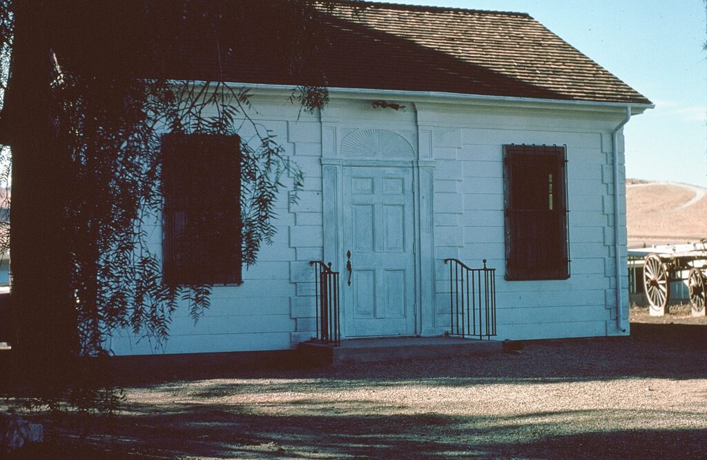 Front view of Simi Library Building, 1978, with wooden door and steps.