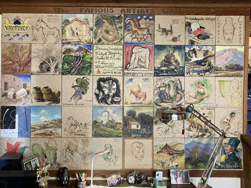 A grid of small artworks by various artists, each labeled with names like Kay Finch and Henry Lion, displayed under a wooden header titled "The Famous Artists' Wall".