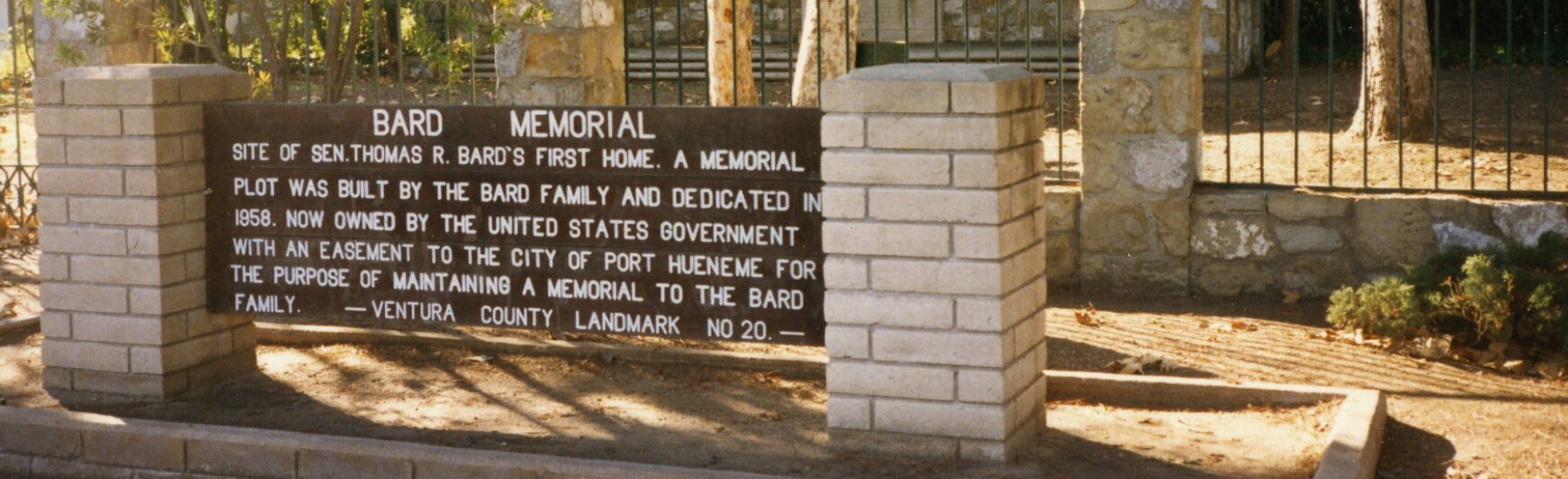 Thomas R. and Mary Bard Memorial showing signage with brick and surrounding trees, 1985