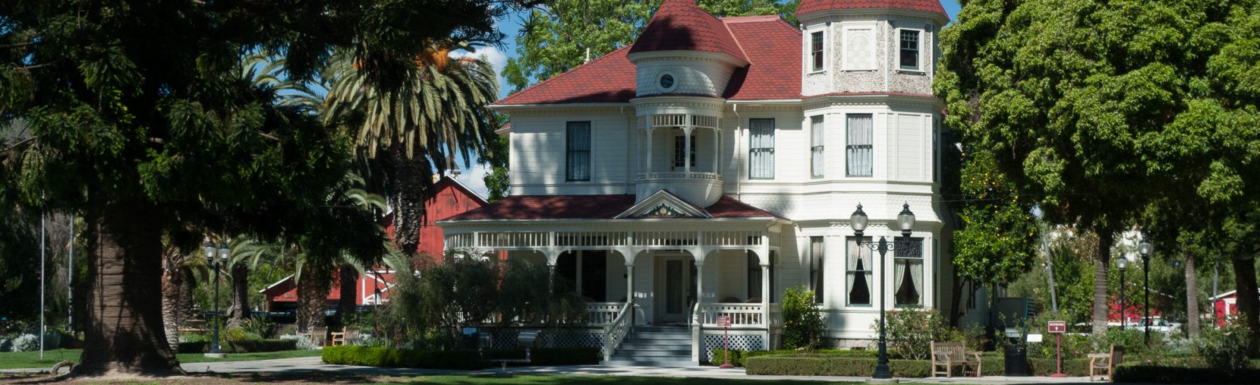 Front view of the Camarillo House, a two-story Victorian home with a turret and porch, 2009.