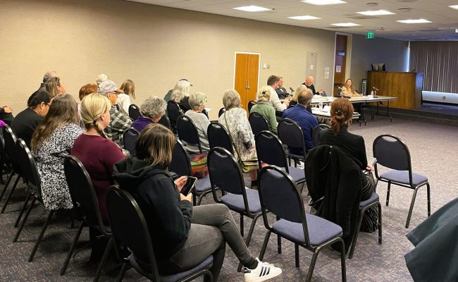 People attending a Mobile Home Park Rent Review Board Hearing.
