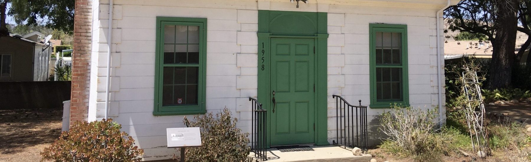 Original Simi Library Building with green door and windows, 2021.