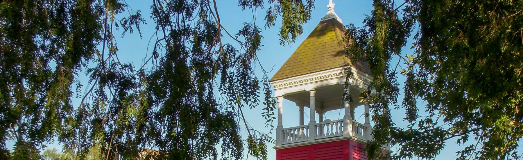 Santa Clara Schoolhouse, a red Colonial Revival building with a tall tower, 2008.